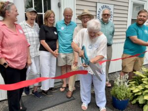 MSC President Susan Goran cuts the ribbon to officially open MSC's new location at 14 Middle Street in Brunswick